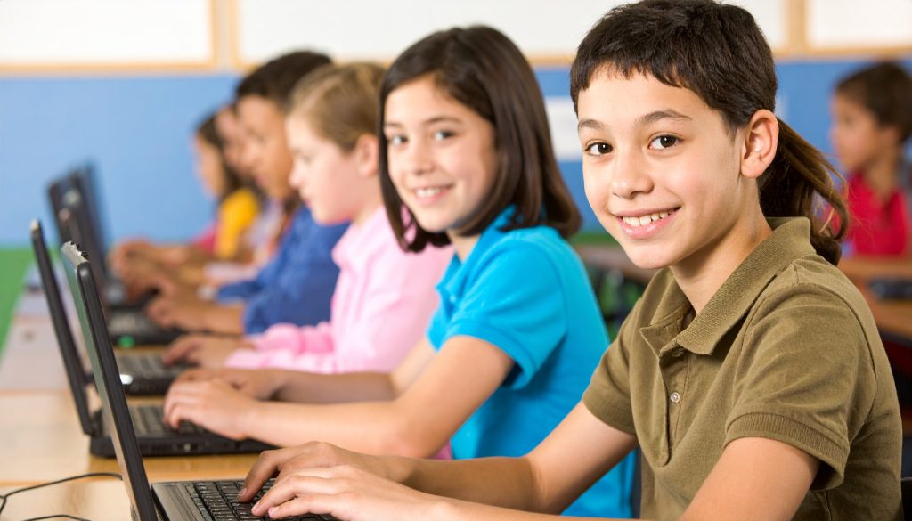 Technology classroom of 5th-grade students learning how to code in Python