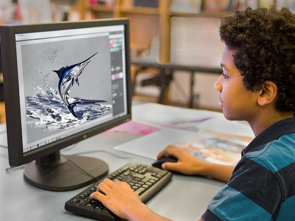 6th grade student working computer lab with PhotoShop