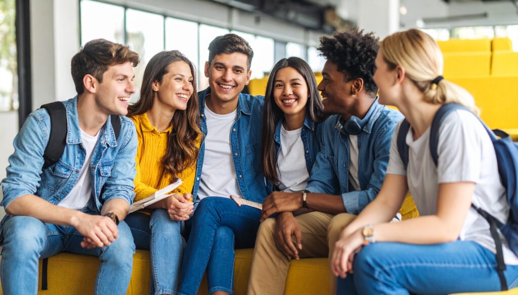 A group of high school students discussing an ELA project.jpg